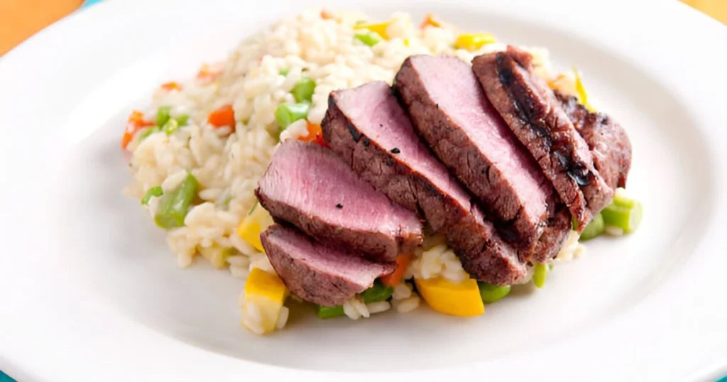 Delicious and easy steak fried rice served with vibrant vegetables.