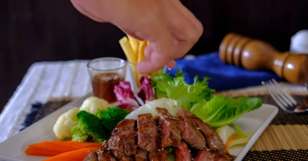 A beautifully plated dish of cabbage and ground beef with vibrant vegetables and garnishes, highlighting a simple and delicious recipe.