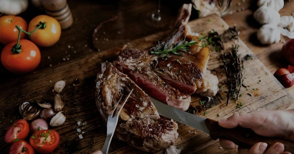 A beautifully plated dish featuring tender beef slices with colorful vegetables, served on a white plate, showcasing an easy and delicious beef recipe idea for a hearty meal.